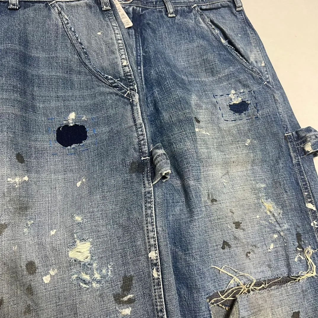Proofing VS ZP SAINT Mxxxxxx SAINT_DENIM PANTS/PAINTER /BLUE Knife cut holes and splashed ink logging trousers Patch jeans Blue S-XL All accessories are molded and customized Super heavy work Washed and worn Knife cut holes Artificial ink splashed graffiti Genuine version Loose and stylish
